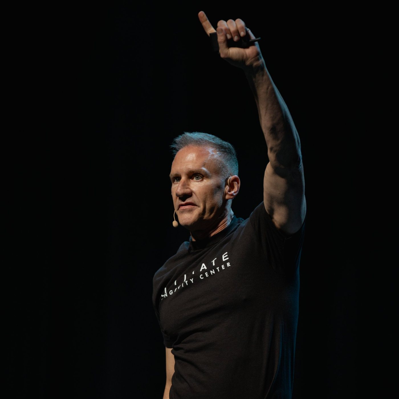 Gary Brecka on stage at a live Ultimate Longevity Center seminar